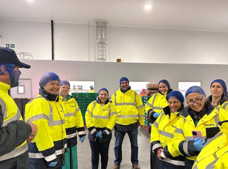 An image of Sergio, Manal and colleagues during a packhouse tour